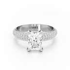 A radiant cut diamond engagement ring with a pavé-set diamond band in a silver-colored metal, featuring the brand name 'SAKE' engraved inside the band, shot against a clean white background.