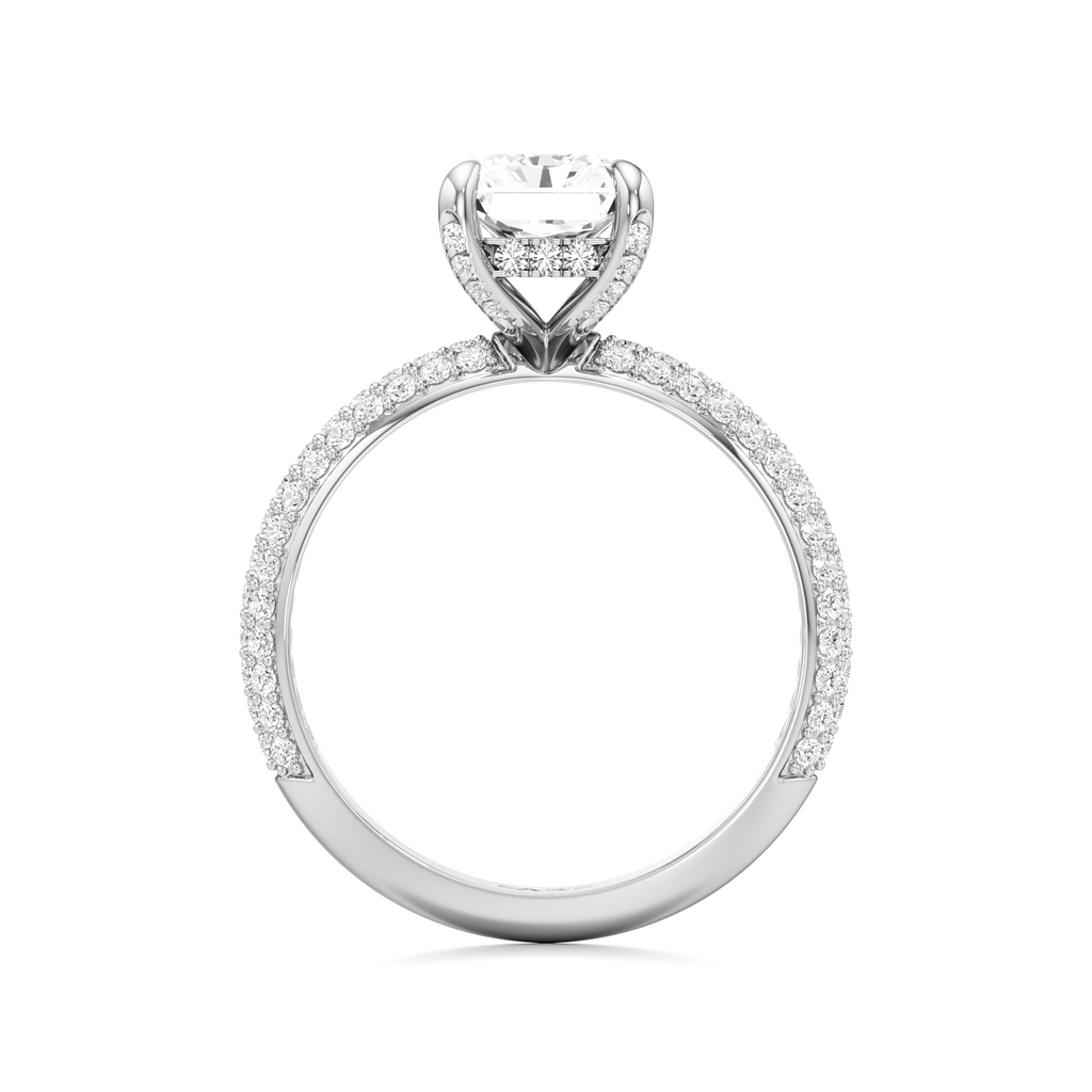 A white gold or platinum solitaire engagement ring featuring a round-cut diamond center stone and pavé-set diamonds along the band, shown on a clean white background.