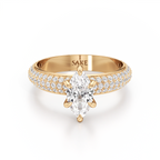 A yellow gold engagement ring featuring a marquise-cut clear center stone and pavé-set diamonds along the shoulders, shown on a clean white background. The inside of the band is engraved with the brand name 'SAKE'.