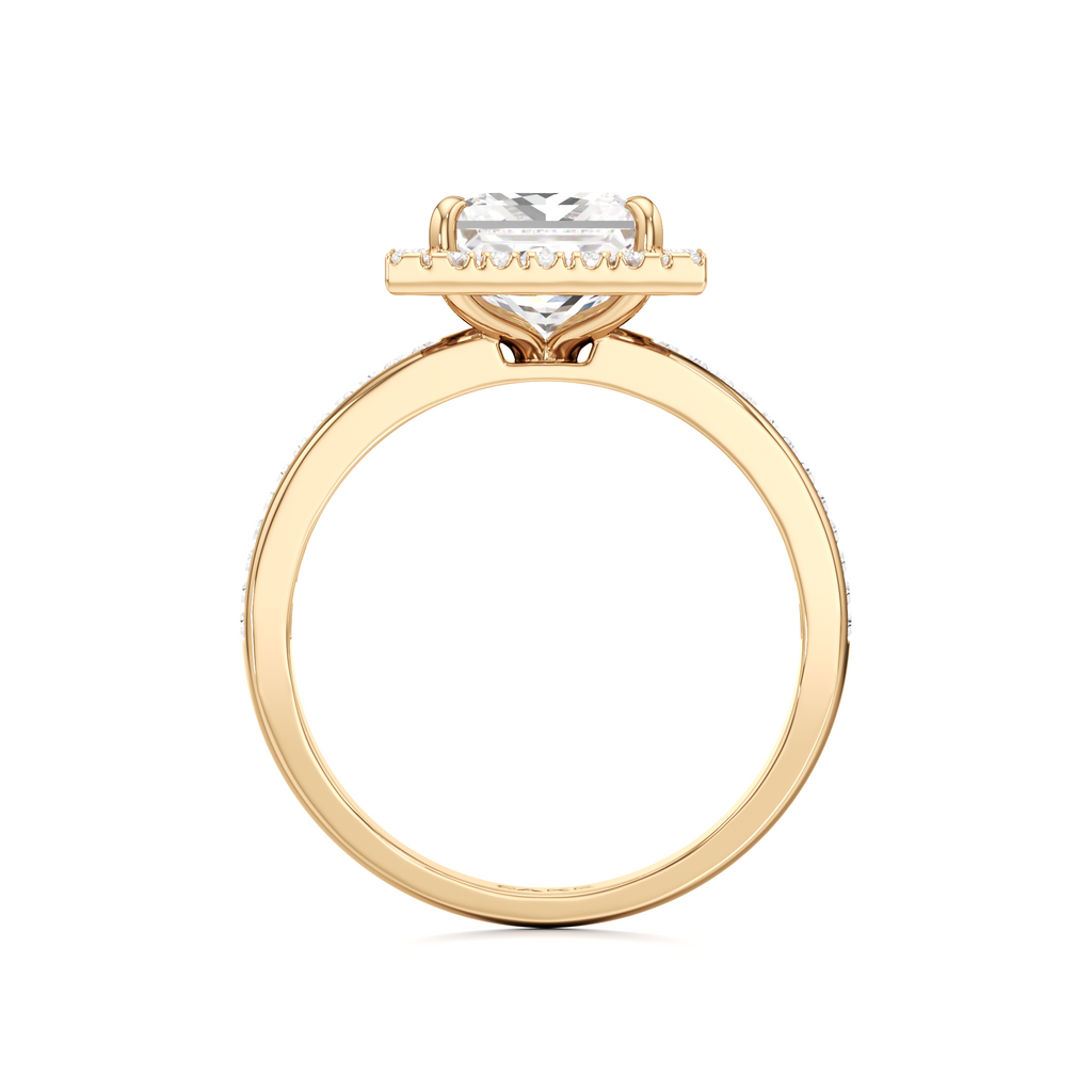 A yellow gold ring featuring a marquise-cut clear gemstone in a prong setting, shown against a plain white background.