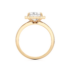 A yellow gold ring featuring a marquise-cut clear gemstone in a prong setting, shown against a plain white background.