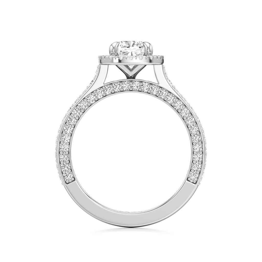 A silver-toned diamond engagement ring with a round-cut center stone and pavé-set diamonds along the shank, shown on a plain white background.