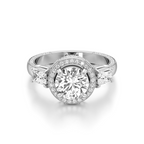 A silver-toned diamond ring with a round-cut center stone surrounded by a halo, flanked by two marquise-cut side stones on a white background.