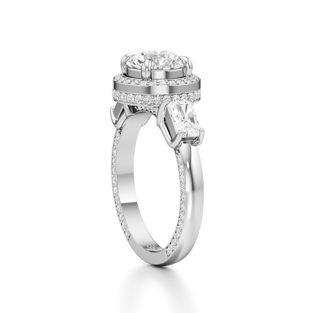 A silver-toned diamond ring with a large round center stone, a halo of small diamonds, and a marquise-cut side stone on a clean white background.