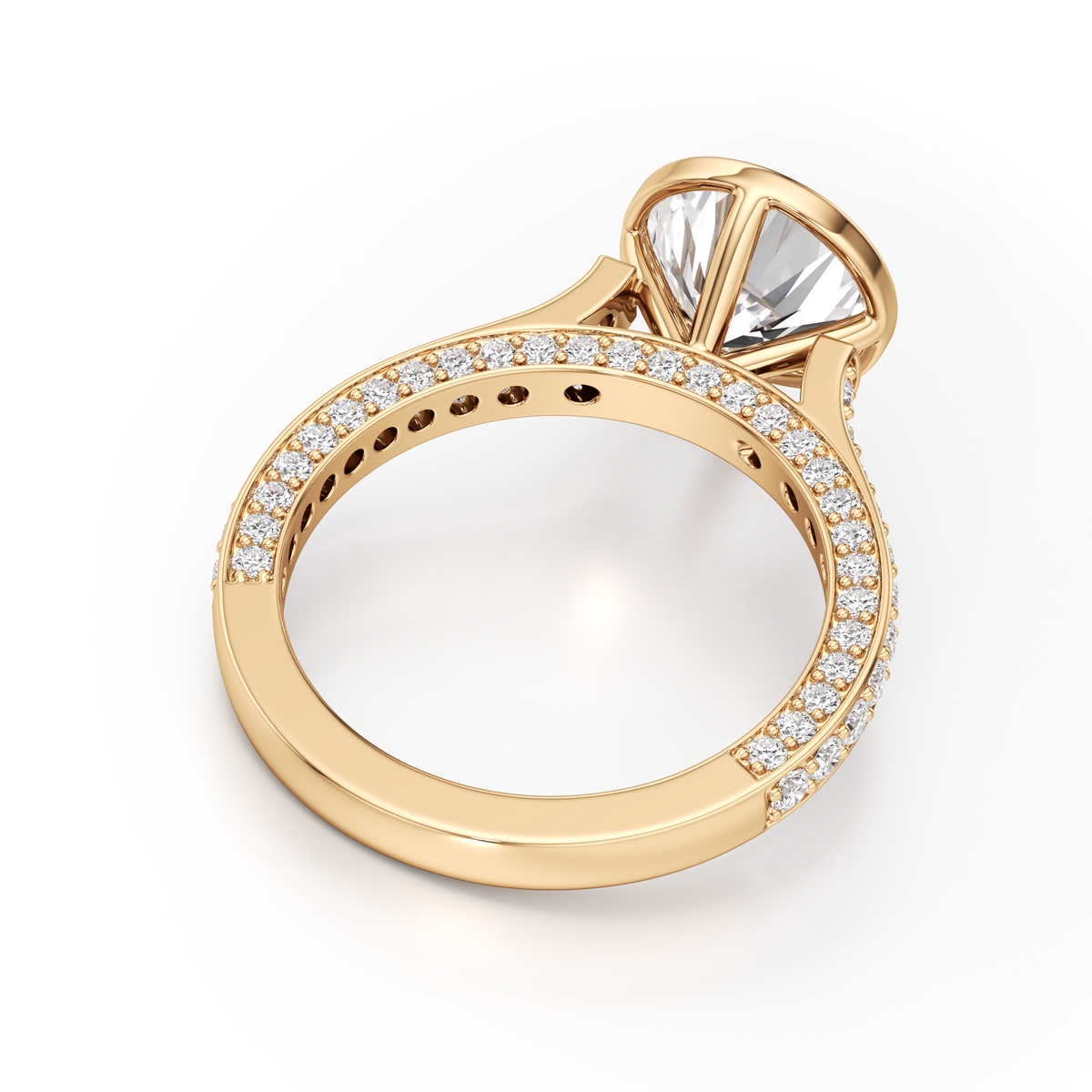 A yellow gold ring with a large marquise-cut clear center stone and a halo setting, featuring a pavé band with small round stones, shown on a white background.