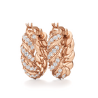 Pair of Helix twisted hoop earrings displayed at an angle, showcasing their sculptural curves and decorative stone details.