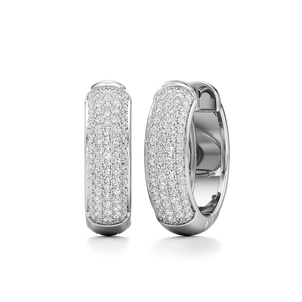 A pair of silver huggie hoop earrings paved with small clear stones, shown from the front and side on a clean white background.