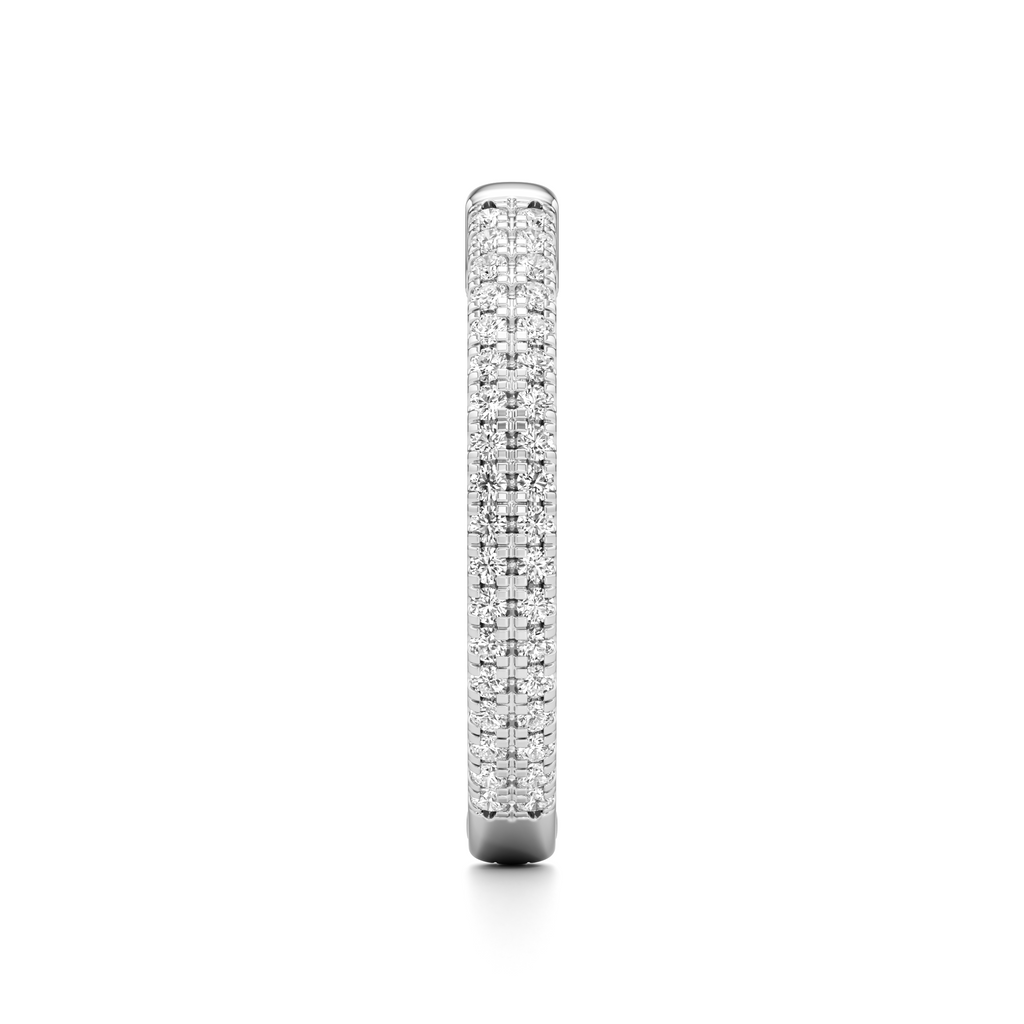 A slim diamond band ring in a silver-toned metal setting, shown vertically against a plain white background.