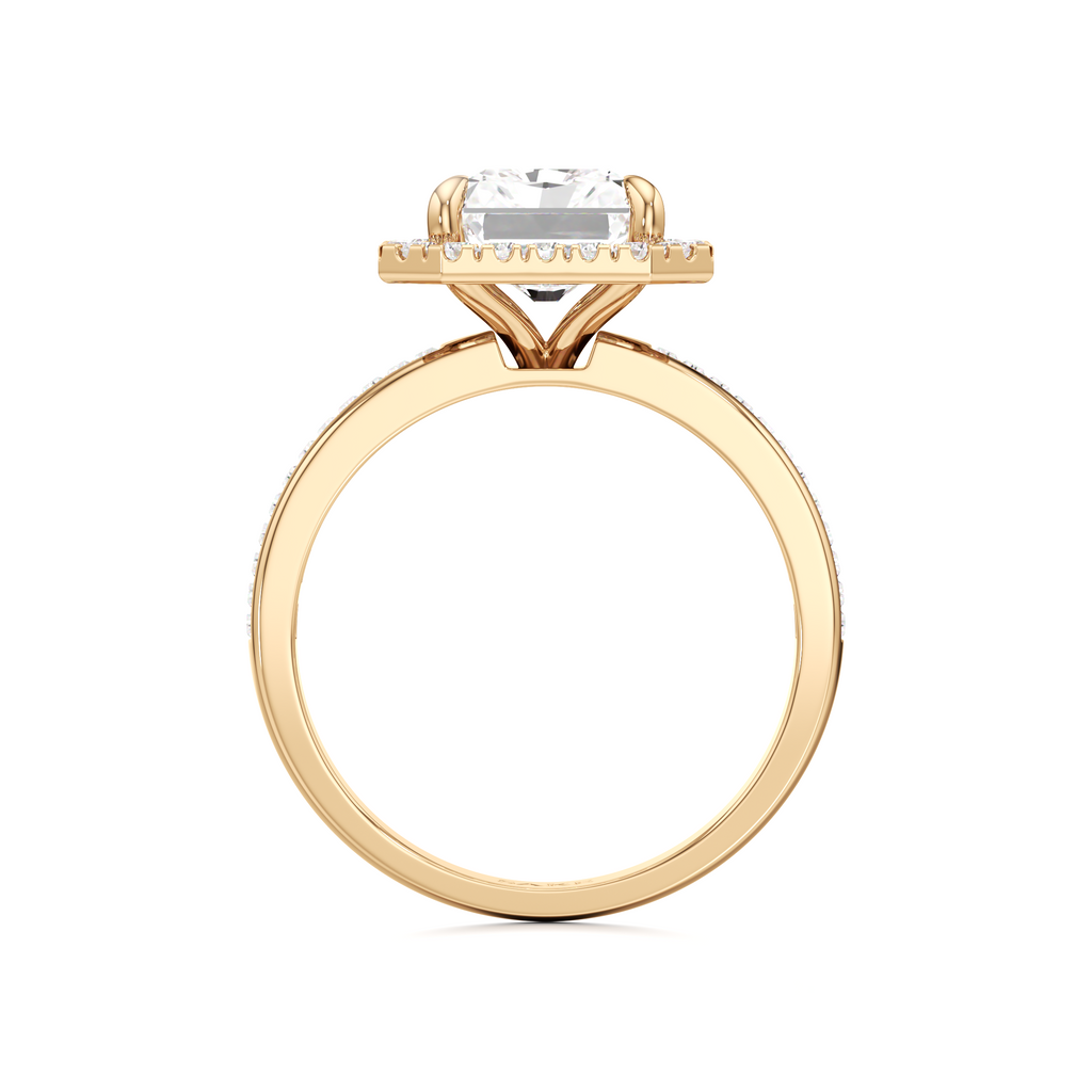A yellow gold diamond ring with a round brilliant-cut center stone and a small halo of diamonds, shown on a plain white background.