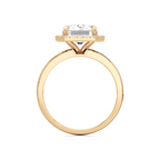 A yellow gold diamond ring with a round brilliant-cut center stone and a small halo of diamonds, shown on a plain white background.