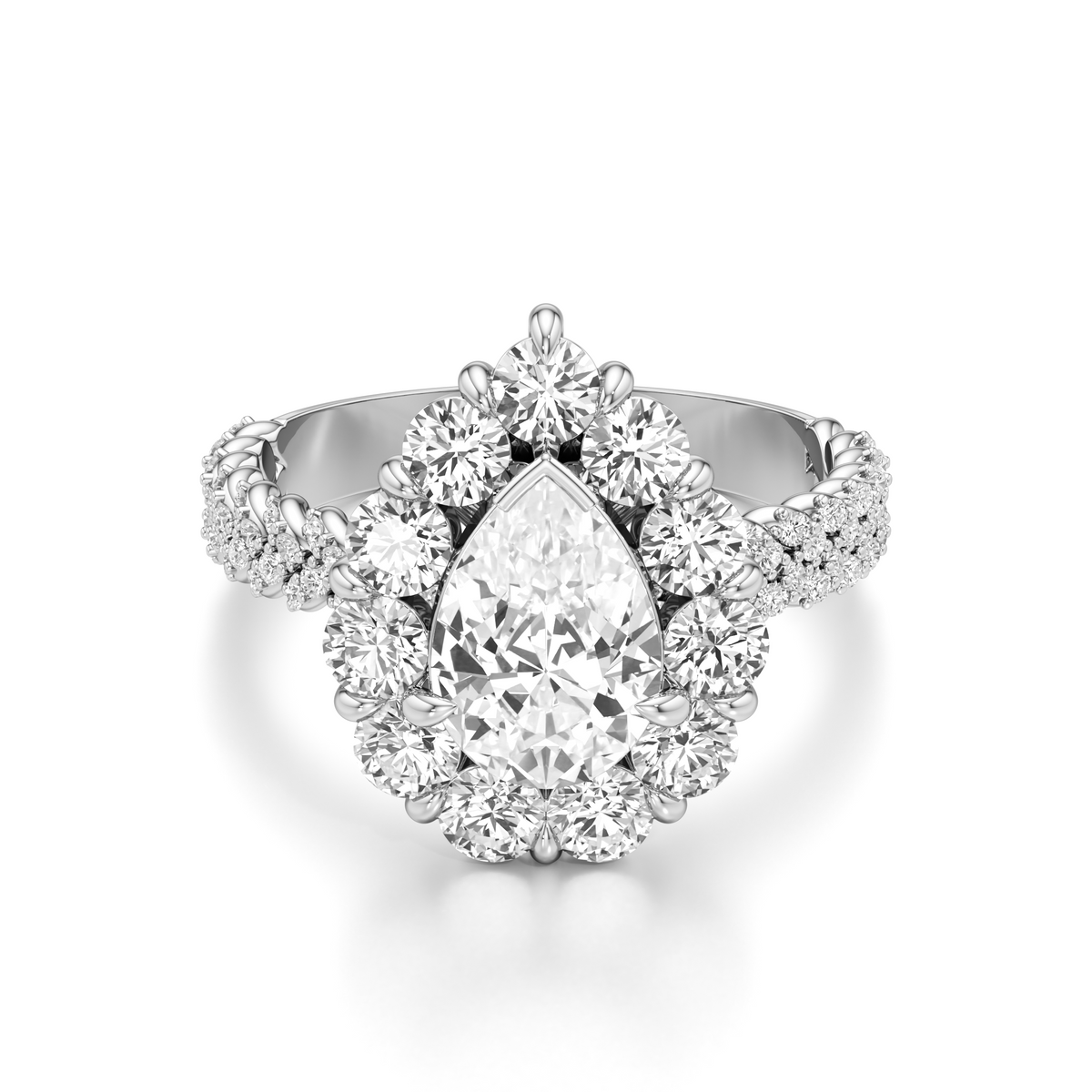 A pear-cut diamond engagement ring with a halo setting and a diamond-encrusted split shank, shown on a clean white background.