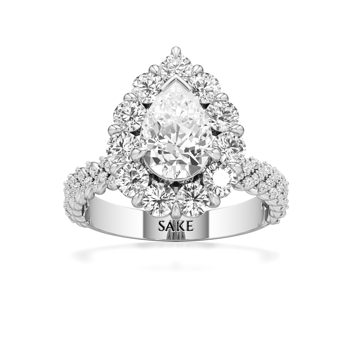 A pear-cut diamond halo ring in white gold or platinum, featuring a large central pear diamond surrounded by round and marquise diamonds, with a split shank engraved with 'SAKE ADAM'.