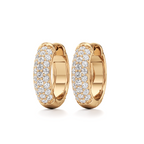 A pair of gold huggie hoop earrings paved with small clear stones, shown on a clean white background.