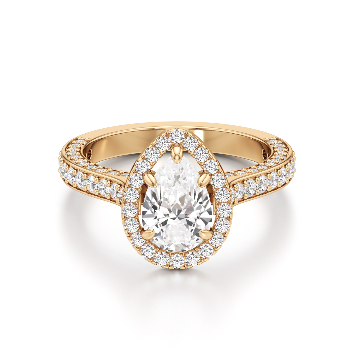 Gold-tone pear-shaped diamond ring featuring a central pear-cut stone, a surrounding pavé halo, and sparkling stones along the band.