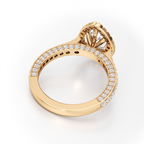 A yellow gold ring with a large oval-cut center stone and a halo setting, featuring a pavé band set with small round stones, shown on a clean white background.