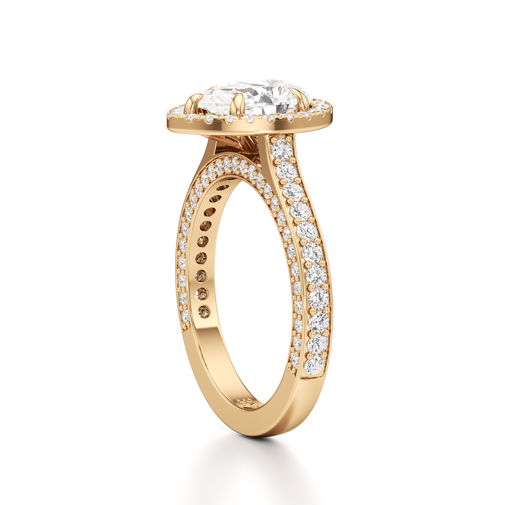 Side view of a gold-tone pear-shaped diamond ring featuring a raised center setting, pavé-set shoulders, and an open gallery beneath the center stone.