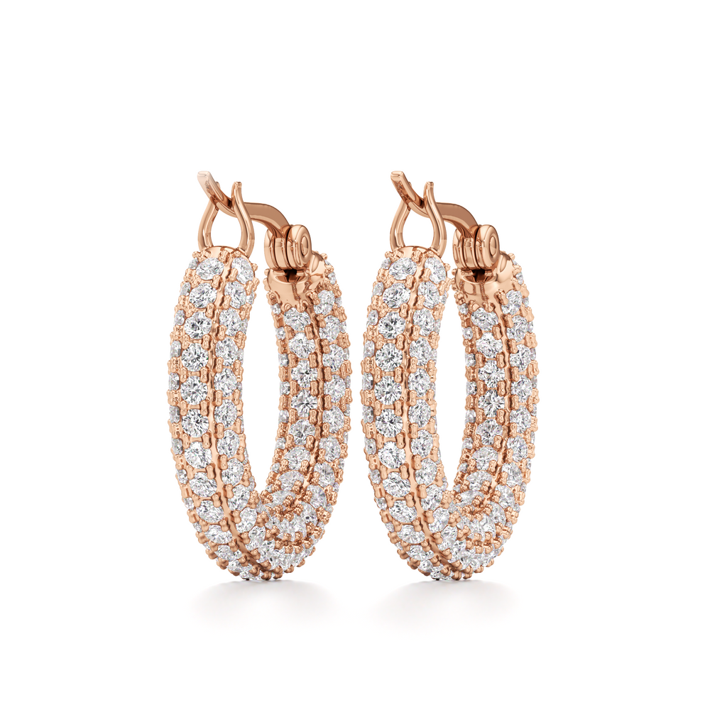 A pair of rose gold hoop earrings with triple rows of pavé-set clear stones, shown on a clean white background.